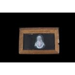 An Early Phantasmagoria Wood-Framed Hand-Painted Slipping Magic Lantern Slide, of a lady’s head