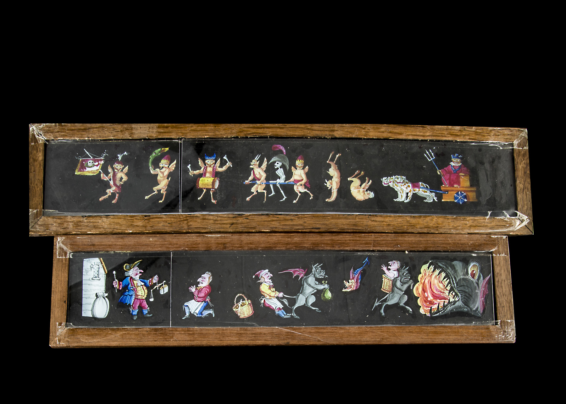 Two Early Mahogany-Framed Hand-Painted Long Procession Slides of Ghouls and Devils, 432mm x 101mm
