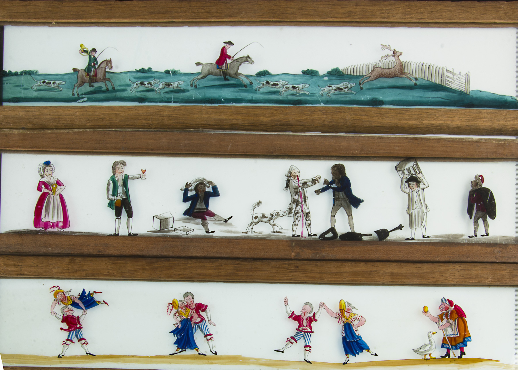 Seven Early Mahogany-Framed Hand-Coloured Long Magic Lantern Slides, 485mm x 104mm, various