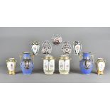 Four pairs of Noritake twin handled porcelain vases, mostly all floral decorated, one pair with