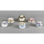 A collection of porcelain boxes and covers, all by Noritake, decorated with floral sprays heightened