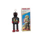 A Yoshiya K.O (Japan) Wind-Up High-Wheel Robot, black tinplate body, red plastic hands, clear