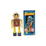 A TAT Hong Kong Battery-operated Spaceman, pink plastic body, yellow arms and legs, dark blue