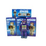 Chinese Space Walk Man Robots, four Battery-operated tinplate robots, one green-grey, one black, two