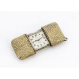 An Art Deco period Movado silver and shagreen purse watch, the retractable ray or shark skin covered