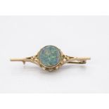 A vintage gold brooch, having oval simulated opal, 5.3cm