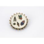 A pretty early 20th century pietra dura brooch, the white marble circular panel inlaid with