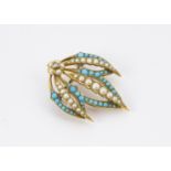 A Victorian gold brooch, in the form of three leaves and set with seed pearls and turquoise beads,