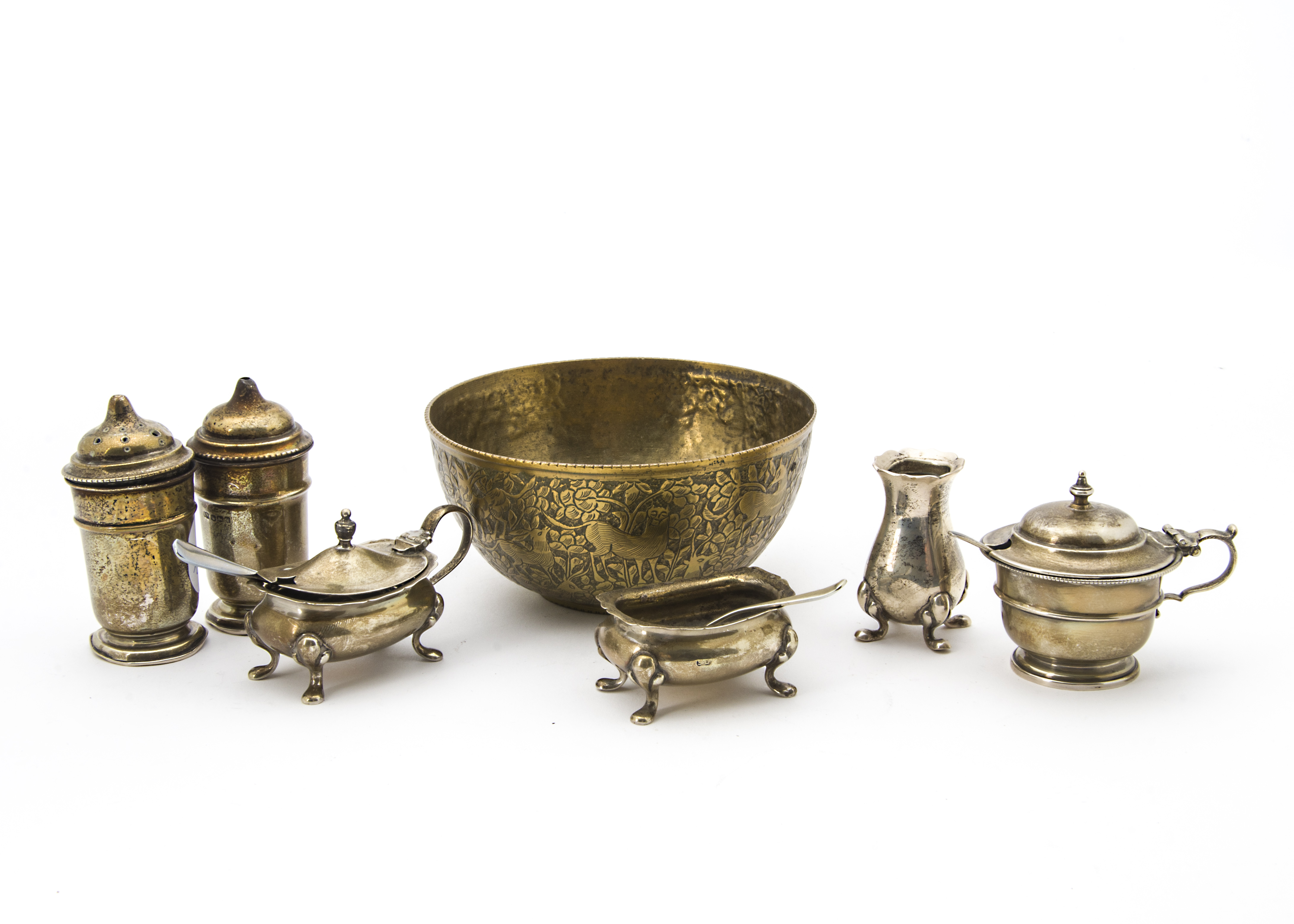 A small group of George V and later silver cruet items, together with a Middle Eastern brass bowl (