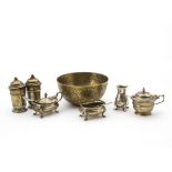 A small group of George V and later silver cruet items, together with a Middle Eastern brass bowl (