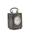 A miniature Edwardian silver travel or desk timepiece from Mappin & Webb, rectangular hammer