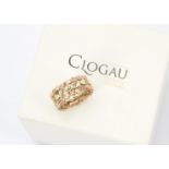 A modern 9ct gold wedding band from Royal Clogau, pierced scroll leaf design in rose and yellow