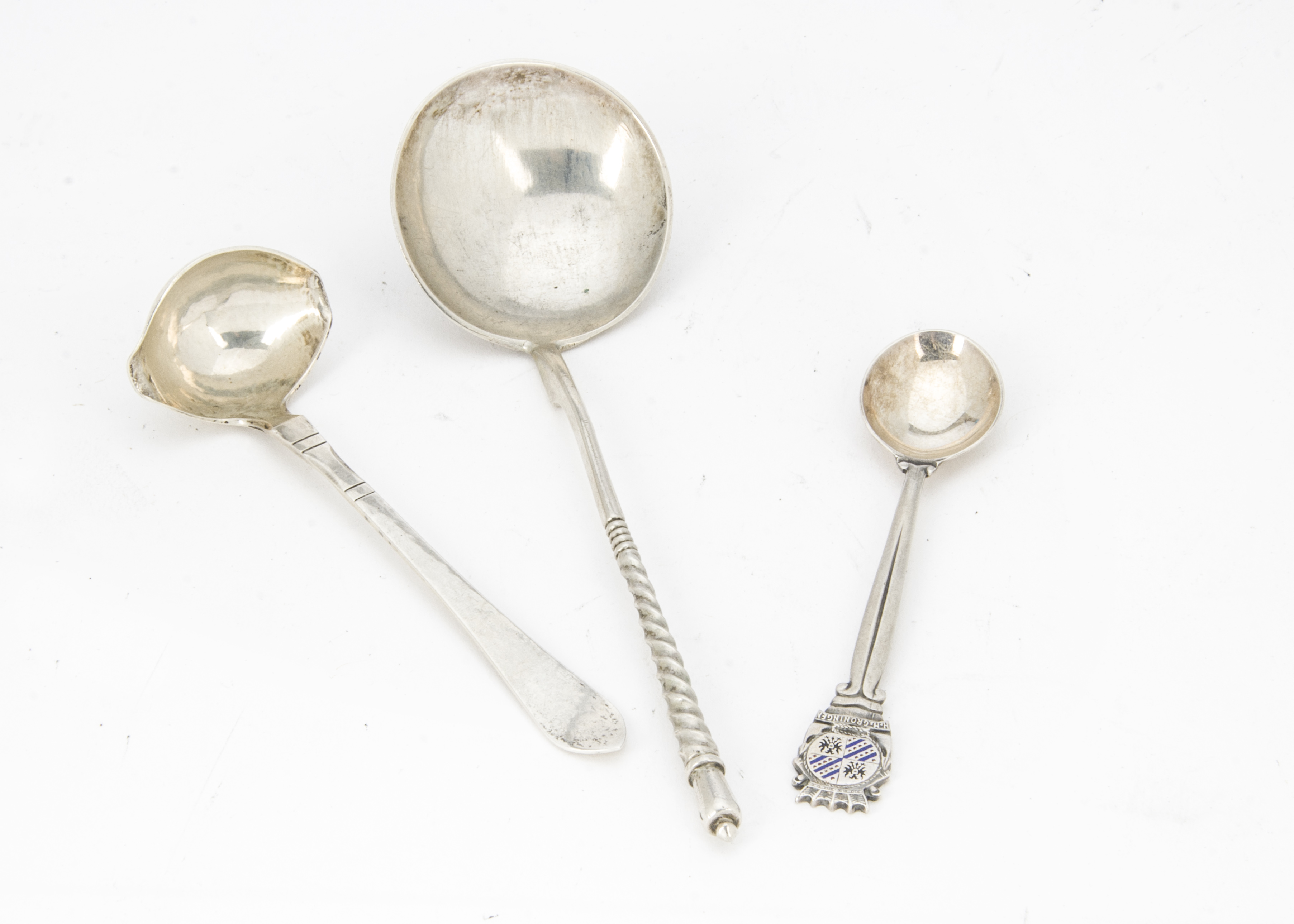 A small Art Deco silver sauce ladle by Georg Jensen, together with a Russian silver spoon and a