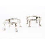 A pair of George V silver stands by Elkington & Co, octagonal on four supports with pad feet (2)