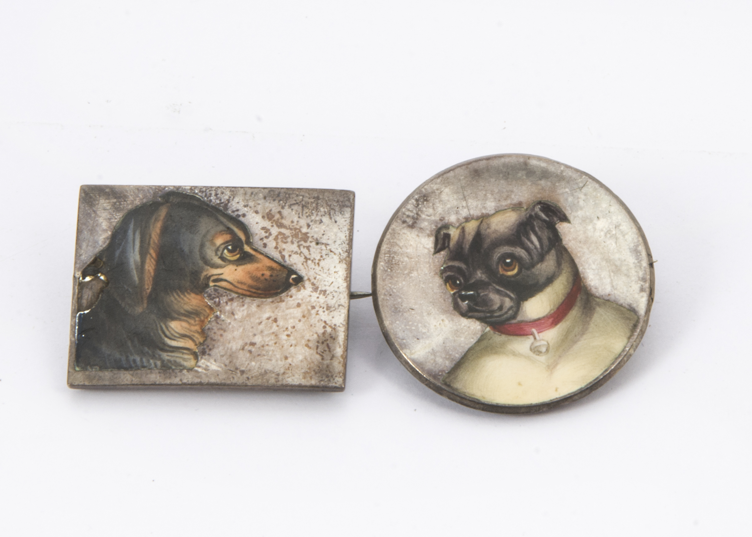 Two interesting late Victorian silver and enamel brooches, one circular with a pug dog, 3.4cm, the