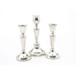 A pair of modern silver filled candlesticks, together with another similar example (3)