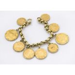 A gold coin bracelet, the round link chain supporting nine gold coins in mounts, including an 1880