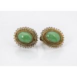 A pair of vintage Chinese earrings, having an oval jade panel within probably silver gilt