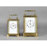 A brass carriage clock by R & W Sorley Glasgow, with French movement, white enamel face, Roman