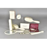 A collection of early 20th Century ivory items, including various items from a dressing set,