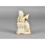 An early 20th Century Indian alabaster statue of the goddess Saraswati, seated and playing a