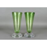 A pair of early 20th Century tapered green glass vases with controlled bubble decoration, each