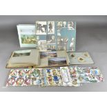 A large collection of mostly 20th Century postcards photographs and prints in 15 albums, subjects