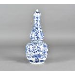 A 19th Century Chinese porcelain blue and white double gourd vase and cover, decorated in blue