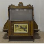 An early 20th Century oak wall mounted cabinet, with shaped and pierced gallery top, two side