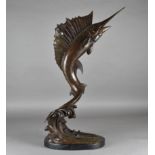 A large 20th Century bronze sculpture of a sailfish, on a black marble base, 81.5cm high