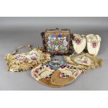 A collection of Native American beadwork embroidery, including a bag decorated with beadwork
