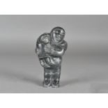 A mid 20th Century Inuit hand-carved soapstone sculpture of a mother and child, with an inscribed