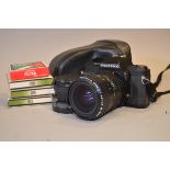 A Pentax P30n 35mm SLR Camera, with 28-80mm f3.5-4.5 A zoom lens, filters, flash unit, manuals,