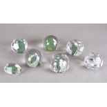 A group of seven lead crystal paperweights by Hubertushütte with silver and granulated green