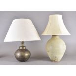 A stoneware ovoid table lamp, 33 cm high, tapered cream shade. Together with an Indian brass