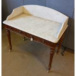 A Victorian marble tray top mahogany wash stand, two drawers, turned supports, casters, 106 cm