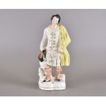 A 19th Century Staffordshire pottery figure of a highlander, hand painted polychrome decoration,