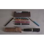A small quantity of early 20th Century fountain pens, including a large squat example, oversized