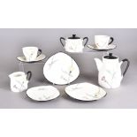 A mid century Japanese tea set, stoneware glazed body with stylised floral design, cups signed to