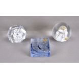 Three lead crystal paperweights by Hubertushütte, one of rectangular form, cobalt blue trails; one