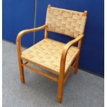 A vintage beech cottage arm chair, with cord back and seat