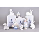 A collection of Lladro and Nao figures, mostly boxed, including two child clown figures, two figures
