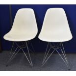 A set of six Charles and Ray Eames Vitra made plastic single chairs, on Eiffel Tower bases, some