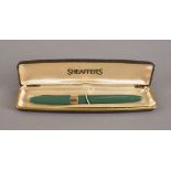 A 1950s Sheaffer's Snorkel Statesman fountain pen, green, original box and instructions