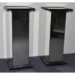 A pair of Art Deco style pedestal tables, black plinth bases, 29 cm wide x 29 cm deep x 68 cm