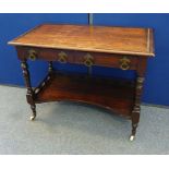 A Victorian walnut two tier wash stand, missing upper gallery, lower pierced gallery, turned