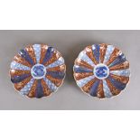 A pair of 19th Century Chinese Imari decorated porcelain decorated plates, scalloped rim, six