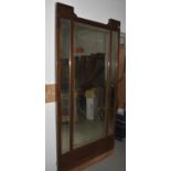 A mahogany rectangular Art Nouveau floor mirror, three bevelled glass mirrors (one a/f) within a