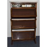 An Edwardian Carr & Co Biscuits mahogany and glazed shop display cabinet, three hinged glazed