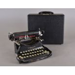 An early 20th Century Corona folding portable typewriter, cased